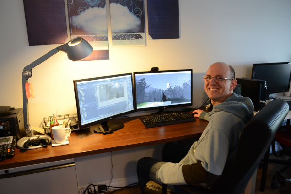 Andrew MacMillan working on computer